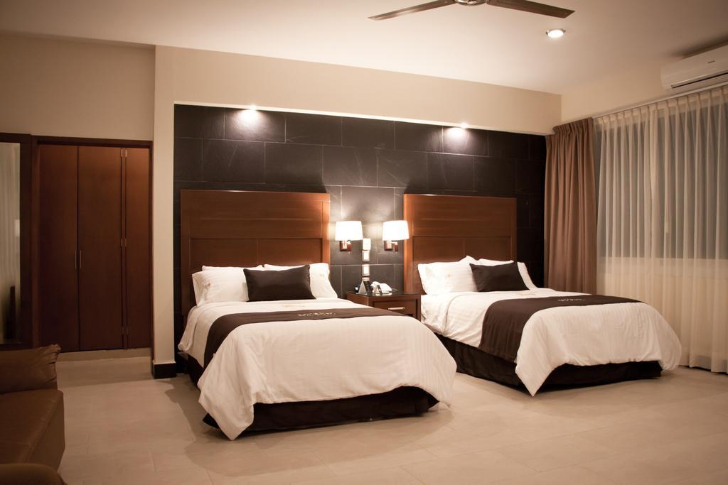 Hotel Ecce Inn & Spa Silao Room photo A bedroom at the hotel